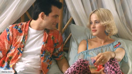 Christian Slater and PAtricia Arquette conversing on a bed in True Romance