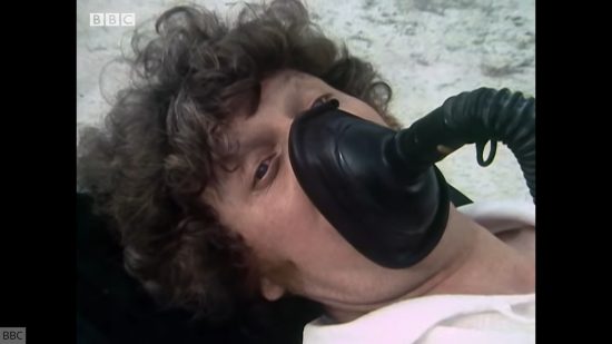 Creepiest Doctor Who stories: The Deadly Assassin. Image shows the Fourth Doctor with an oxygen mask on.