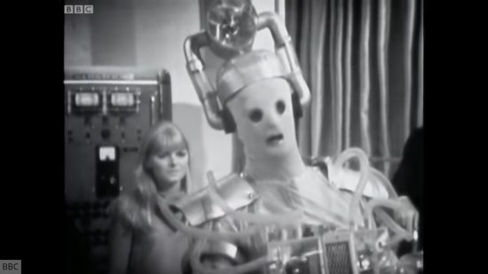 Creepiest Doctor Who stories: The Tenth Planet. Image shows an original Cyberman with Polly Wright behind it,