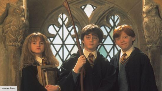 Harry, Ron and Hermione standing in Hogwarts