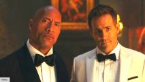 Ryan Reynolds and Dwayne Johnson in Red Notice wearing suits
