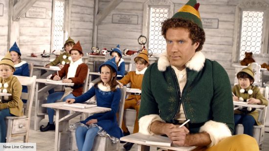 Elf cast: Buddy in a classroom surrounded by Santa's Elves