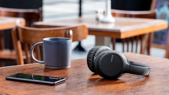 Sony headphones sitting peacefully on a table in a cafe.