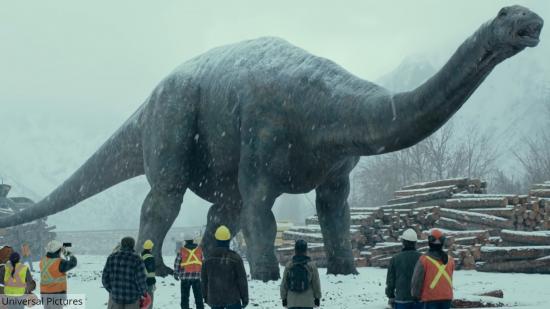 Jurassic World Dominion DVD release date - a still shows two dinosaurs in a snowy forest.