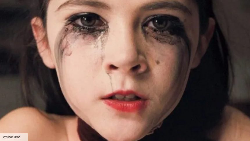 Orphan true story: Esther crying with makeup on her face