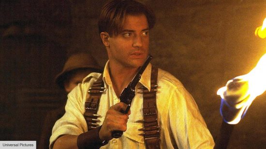 Brendan Fraser in The Mummy 2 holding a torch on fire