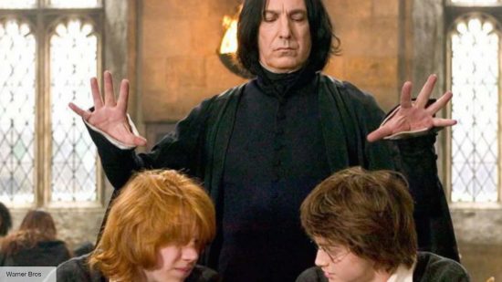 Snape about to hit the heads of Ron and Harry in Harry Potter