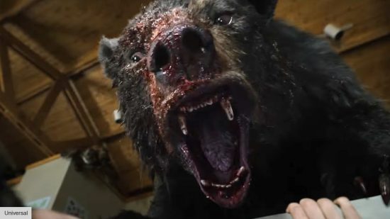 bear roaring with blood in cocaine bear
