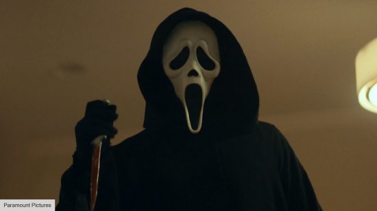 Ghostface explained: Ghostface holding a bloody knife