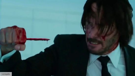 John Wick (Keanu Reeves) with a bloody penicl