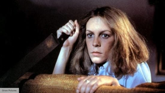 Jamie Lee Curtis as Laurie Strode brandishing a knife in Halloween (1978)