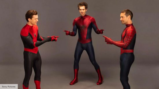 Tom Holland, Andrew Garfield and Tobey Maguire point at each other while dressed as SPider-Man