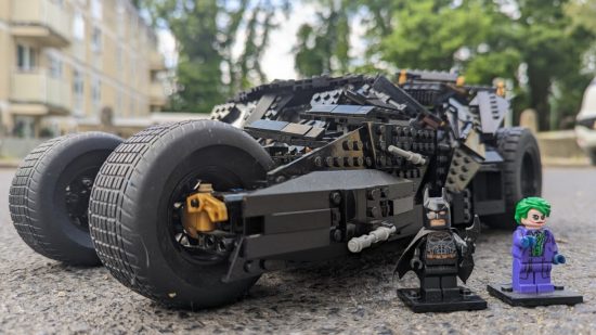 Best Lego Batman sets: the Dark Knight Tumbler. Image shows the set assembled and sitting outside in front of a block of flats.