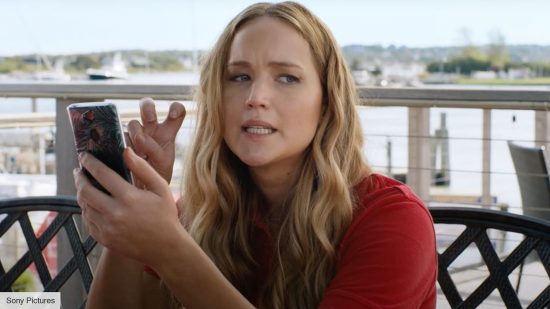 How to watch No Hard Feelings: Jennifer Lawrence as Maddie in No Hard Feelings on her phone 