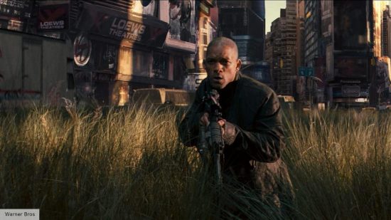 I Am Legend 2 release date: Will Smith holding a gun in the middle of a field in I Am Legend 