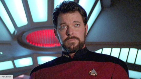 Jonathan Frakes in Starfleet uniform looking seriously off camera in Star Trek: The Next Generation