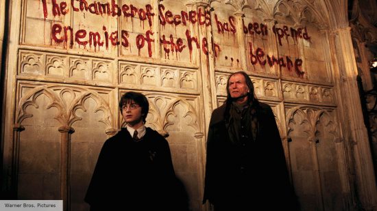 Harry Potter movies in order: Daniel Radcliffe as Harry and David Bradley as Filch in Chamber of Secrets
