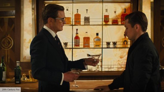 Kingsman 3 release date: Taron Egerton as Gary "Eggsy" and Colin Firth as Harry Hart at a bar 