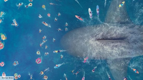 Meg 3 release date: a Meg shark below a beach full of humans in The Meg 