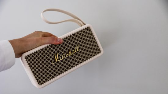 The Marshall Middleton bluetooth portable speaker in the hand