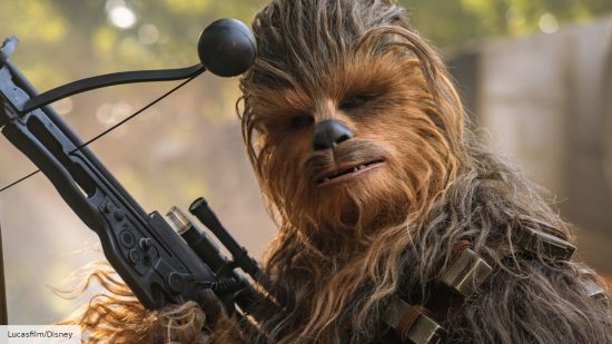 The best Star Wars characters: Chewbacca holding a weapon