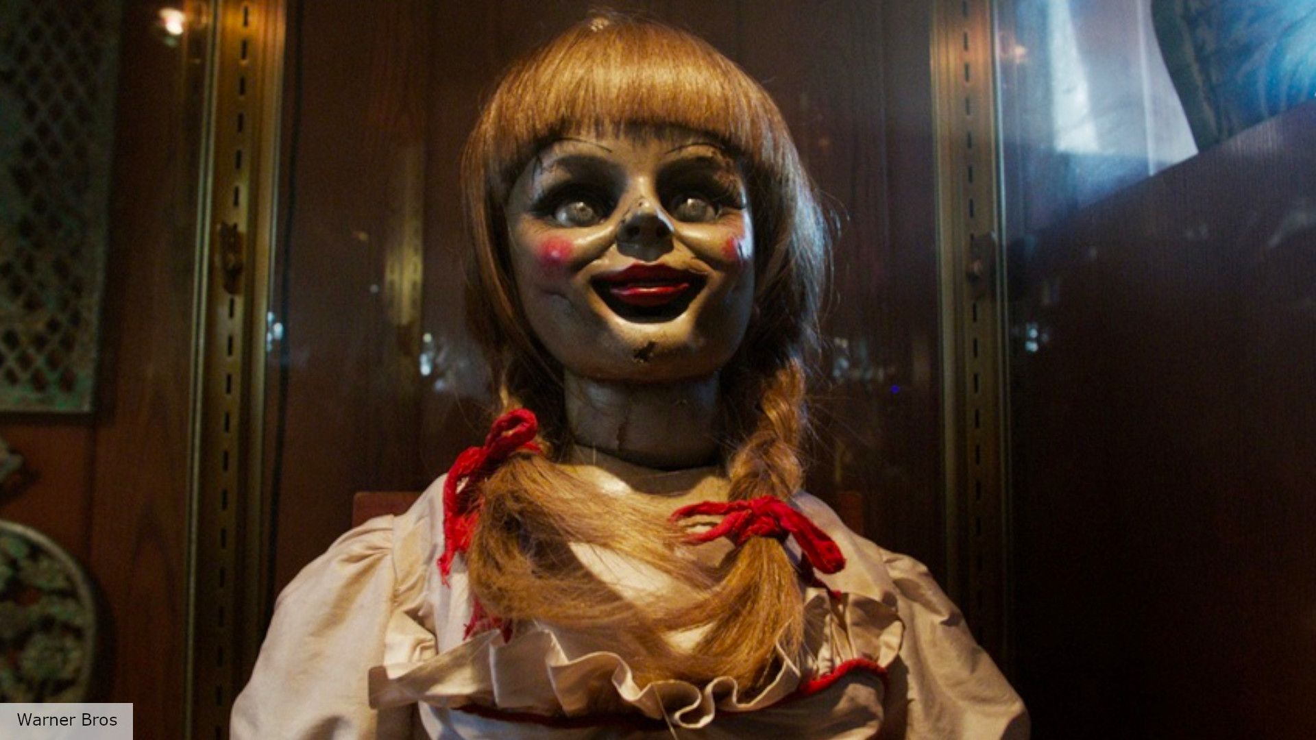 The Conjuring: Annabelle in the Conjuring movies behind her glass case box