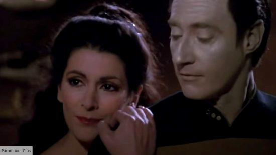 Troi and Data in an embrace in TNG episode Tin Man