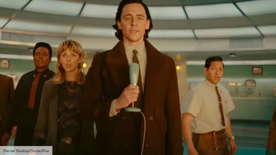 Loki season 2 review: Loki looks out of the window mournfully holding a mic