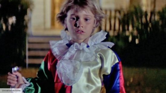 Michael Myers as a six year old kid dressed as a clown after killing his sister in Halloween 