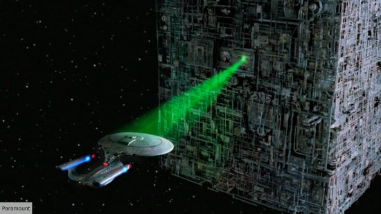 A Borg cube locking its tractor beam on the Enterprise D in Star Trek TNG