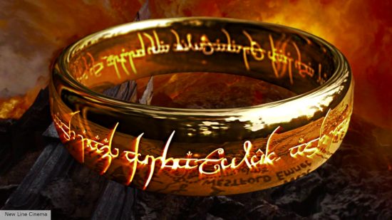 The One Ring with its inscription glowing with Mount Doom behind it in Lord of the Rings