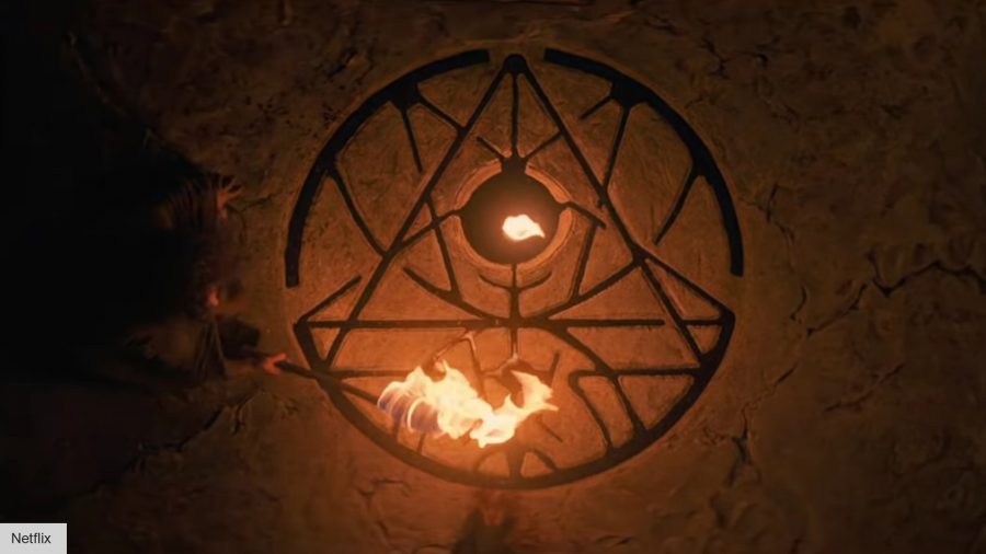 A circular symbol of black magic, carved into the ground and filled out with blood, viewable by firelight