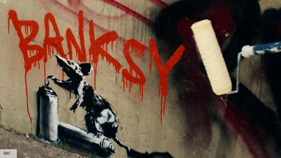 Banksy art work of a black rat on a spray paint can 