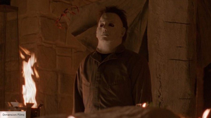 Michael Myers origins explained: Michael Myers standing next to a body and some lit candles
