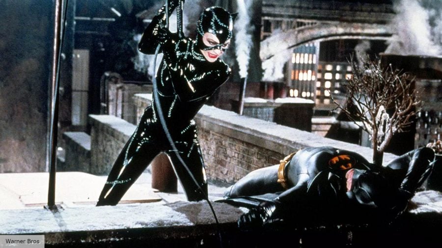 Best Catwoman: Selina Kyle fighting Batman on a rooftop 