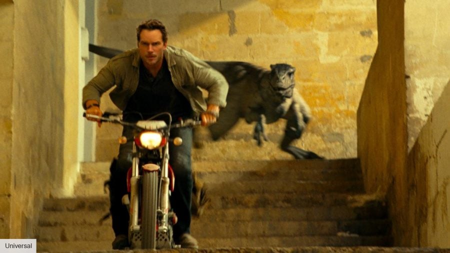 Jurassic World Dominion ending explained: Owen riding away from a Raptor on a motorbike 
